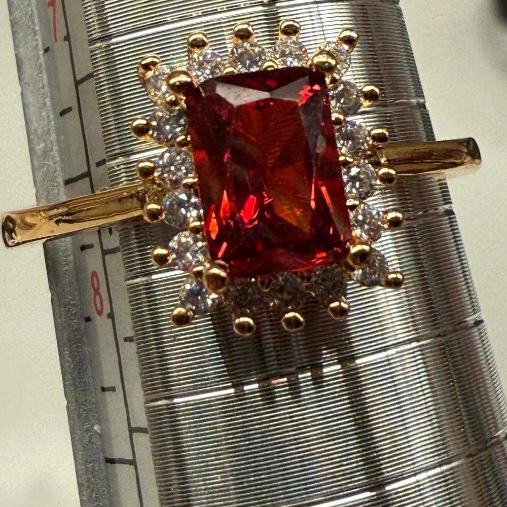 Radiant Gold Plated Ring with Red Gemstone